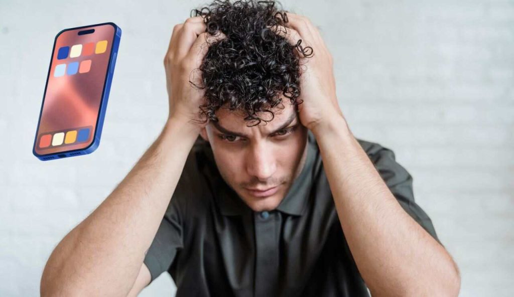 Uomo con stress da smartphone